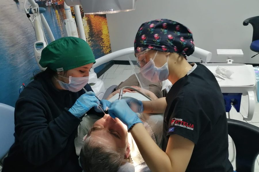 Dr. Dt. Tuba Akcakus Battal performing dental crown procedure — specialist prosthodontist Antalya