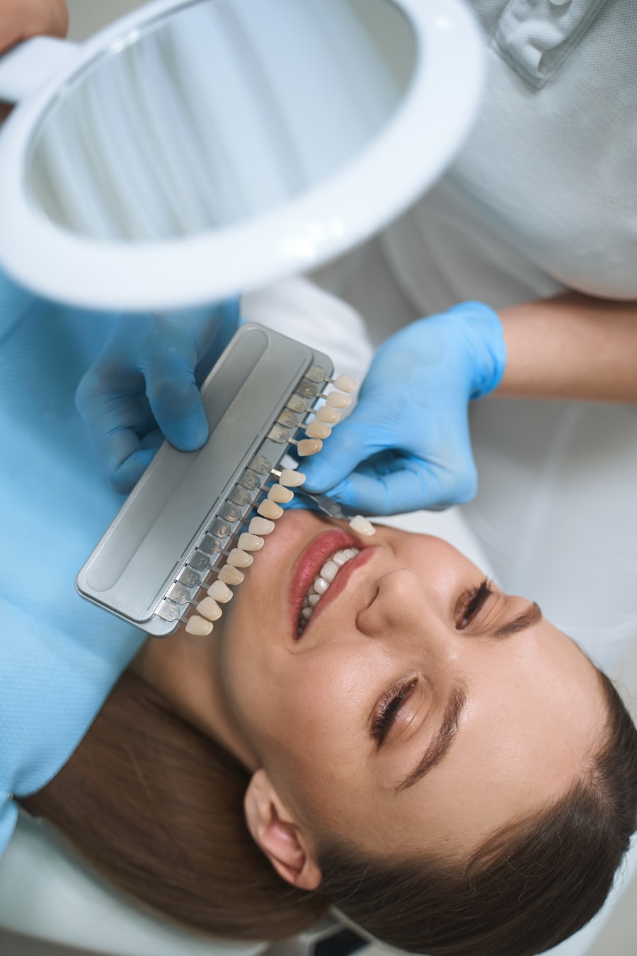 Shade selection during a porcelain veneer consultation with Dr. Dt. Tuba Akcakus Battal, specialist prosthodontist