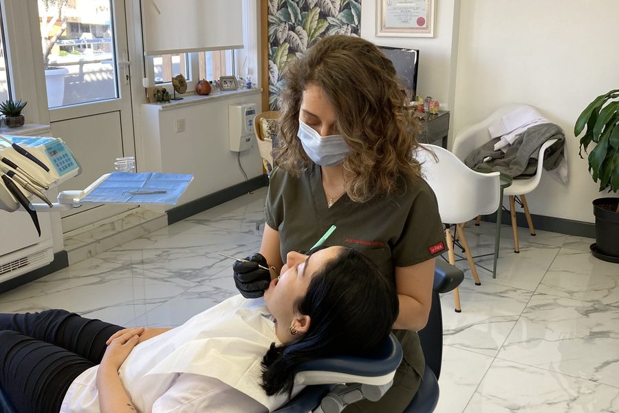 Dr. Dt. Tuba Akcakus Battal performing TMJ treatment — specialist prosthodontist